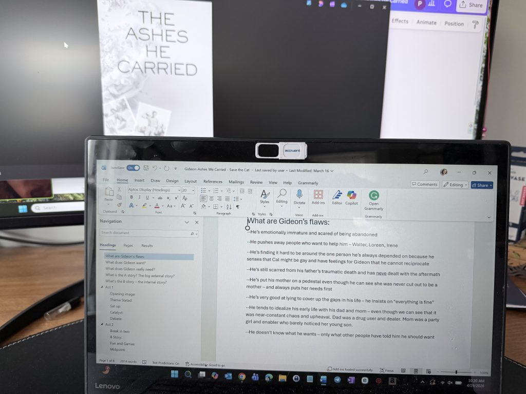 laptop and monitor showing editing of The Ashes He Carried